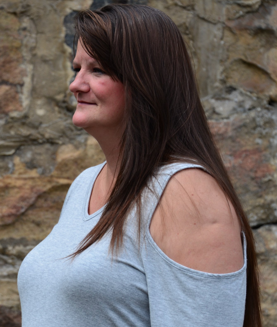 profile of a woman with long brown hair