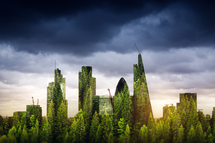 a cityscape where all the buildings are covered in greenery