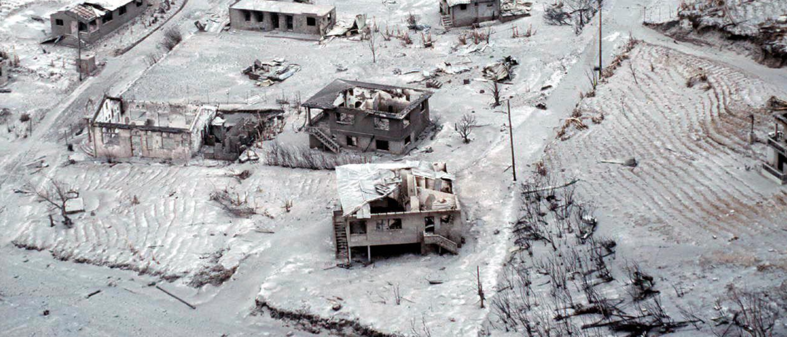 ruins of a town covered in gray ash