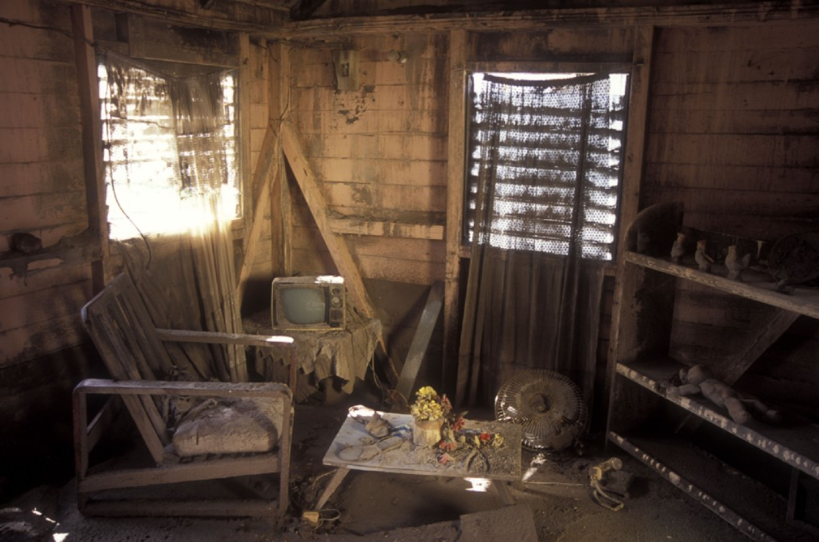 the inside of a living room, covered in ash