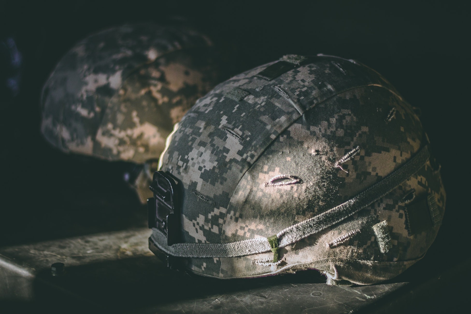 camo helmets resting on a table