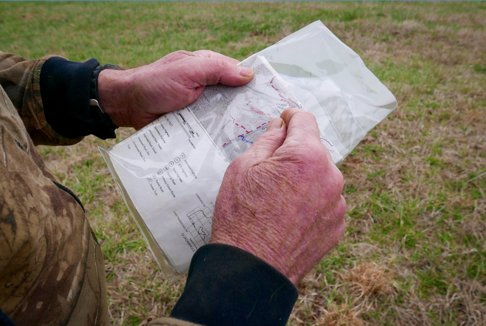 hands holding a map