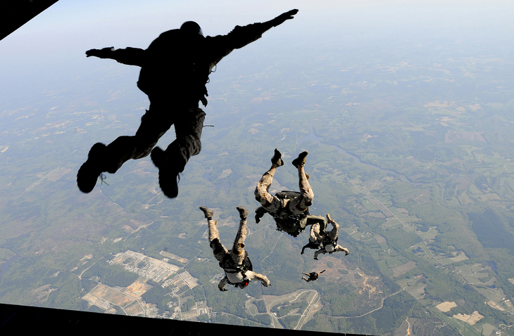 people jumping out of an airplane