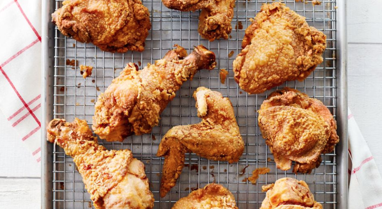 fried chicken cooling on a wire rack