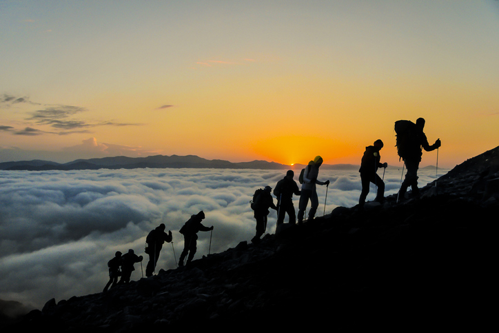 people ascending a mountain