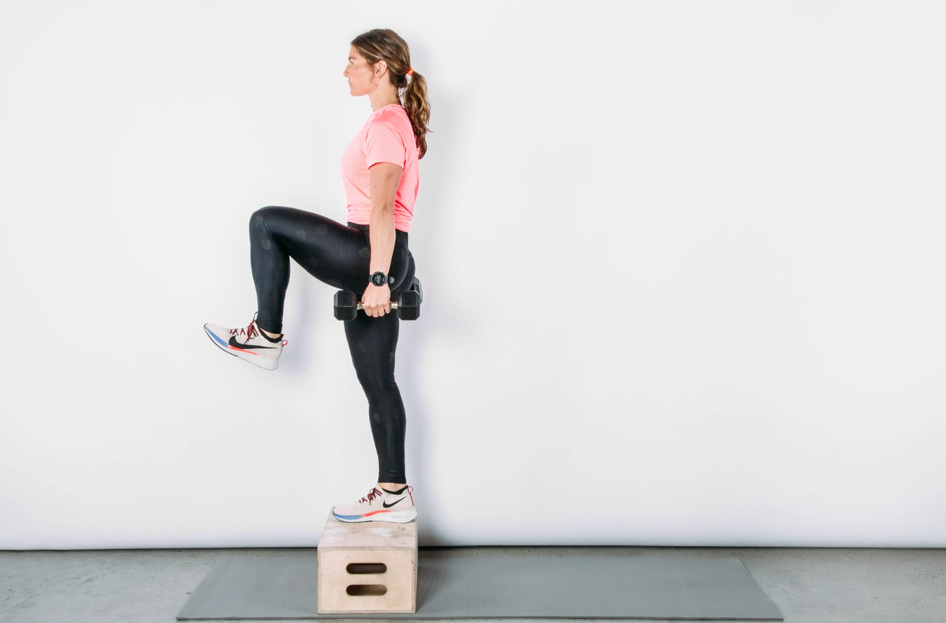 person standing on box with one leg lifted