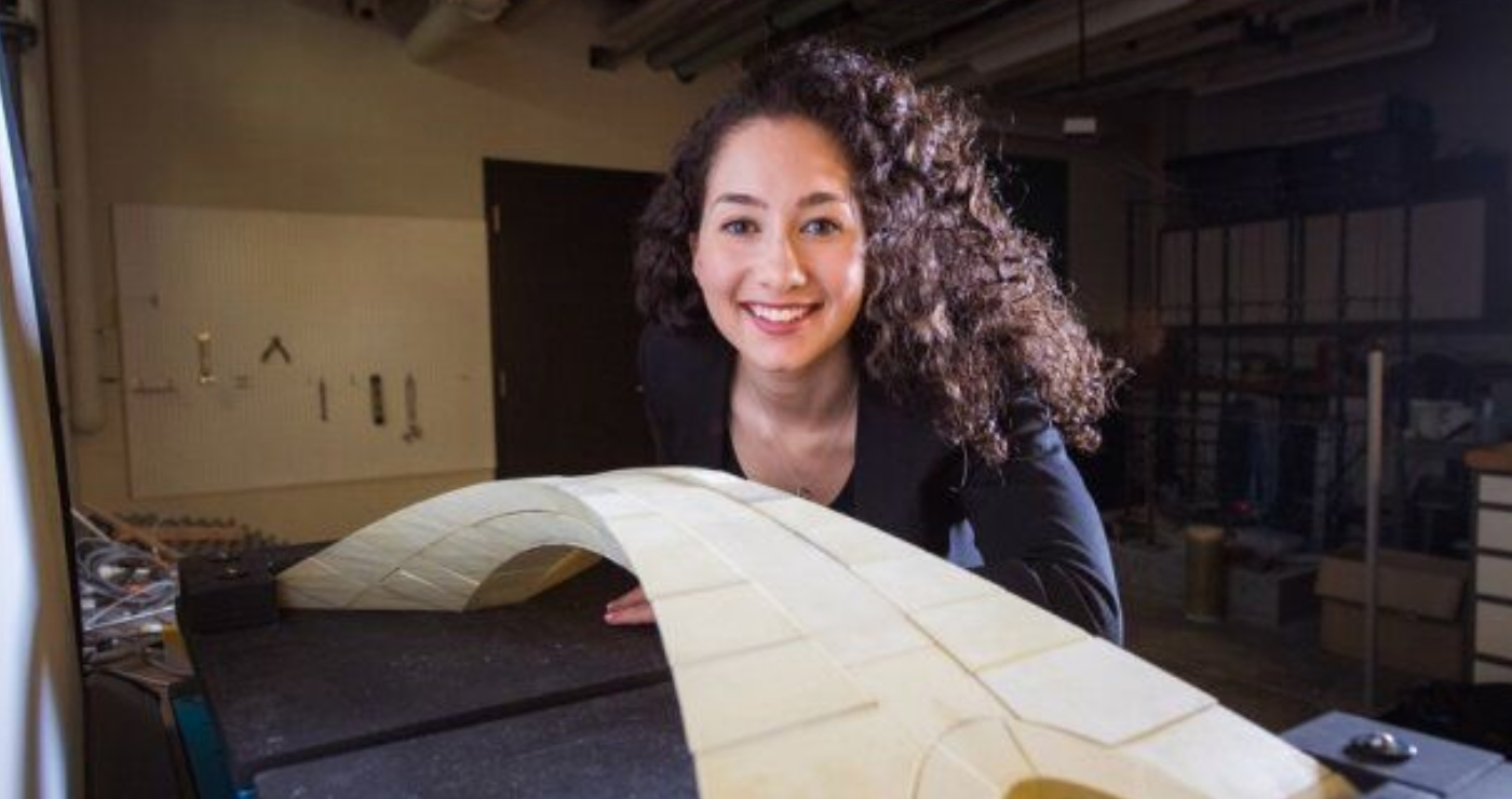 girl posing with bridge model