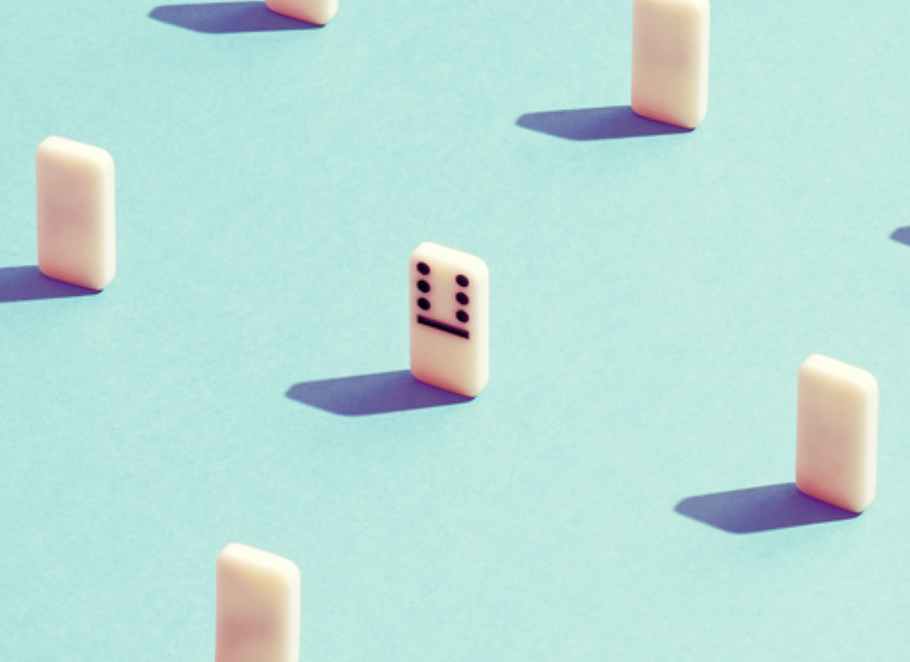 one domino with spots, among many without