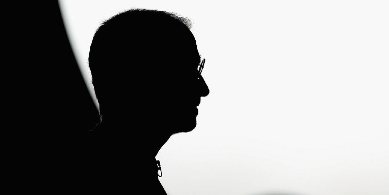 silhouette of a person in front of a white and black backdrop