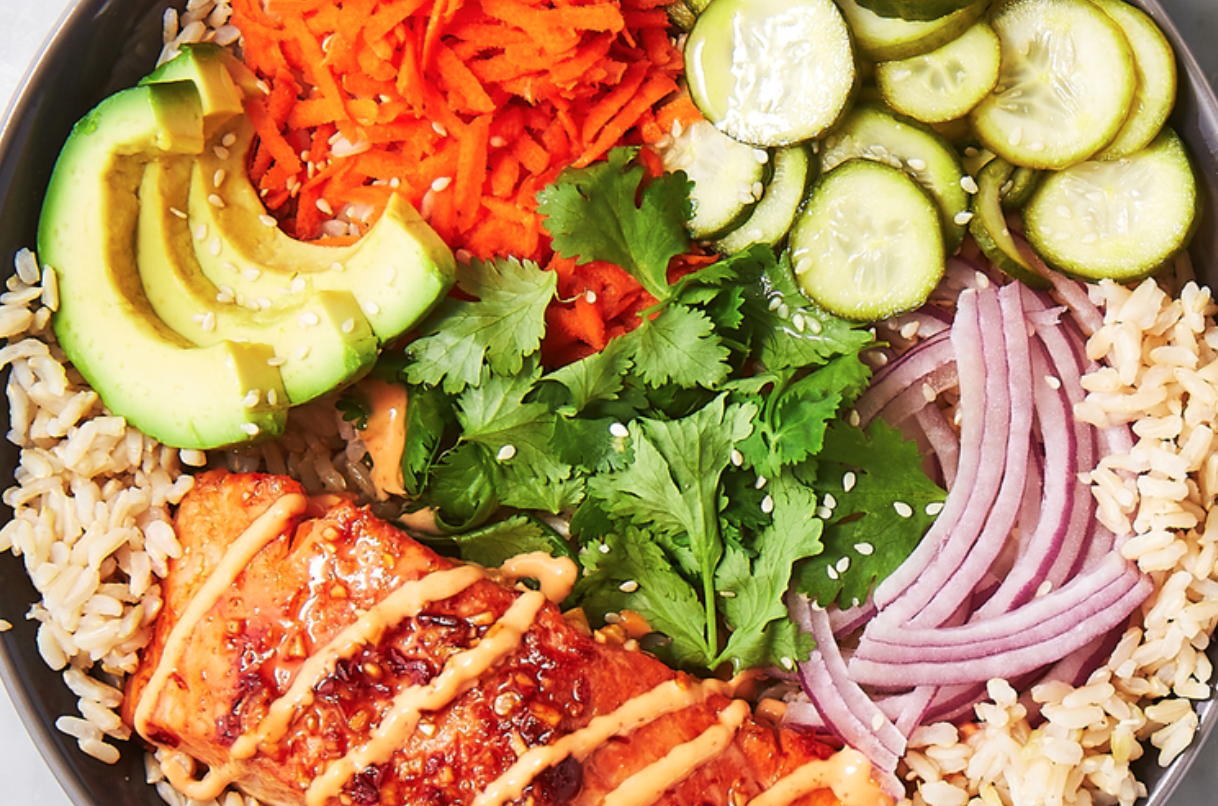 bowl of grains and fish and veggies