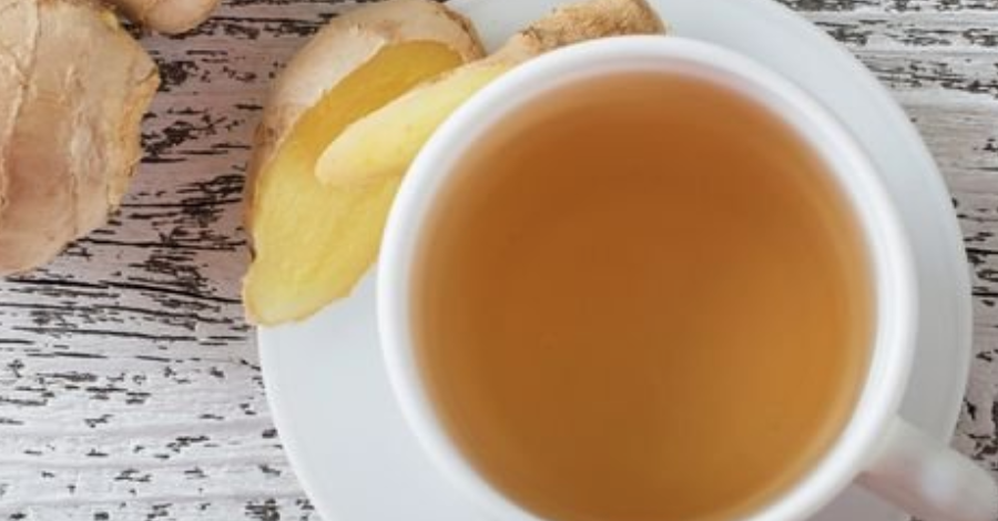 ginger tea next to raw ginger