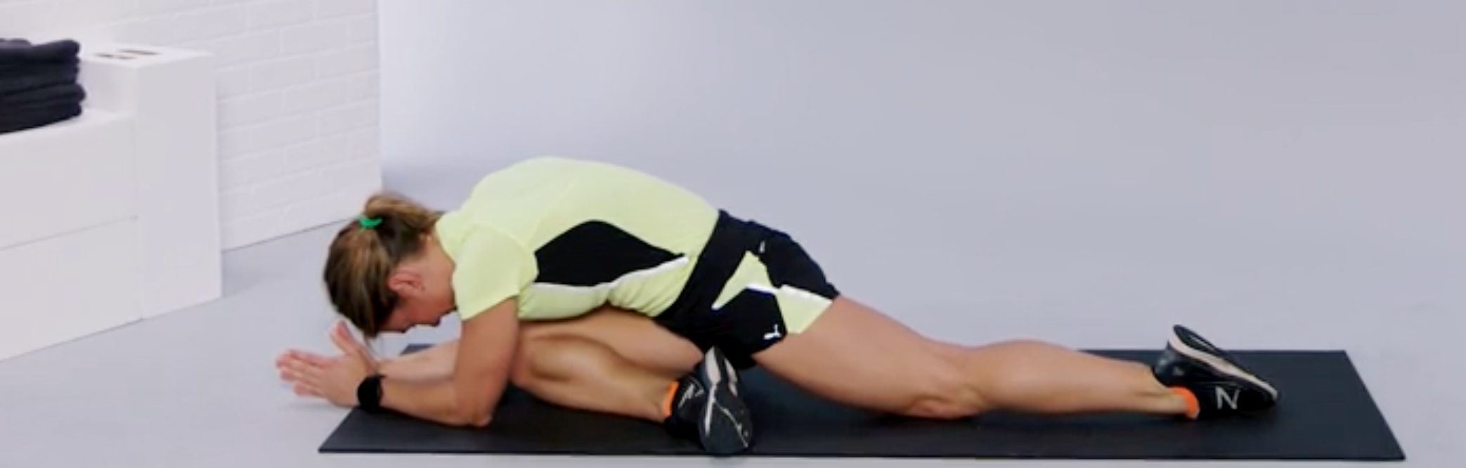 person doing a glute stretch