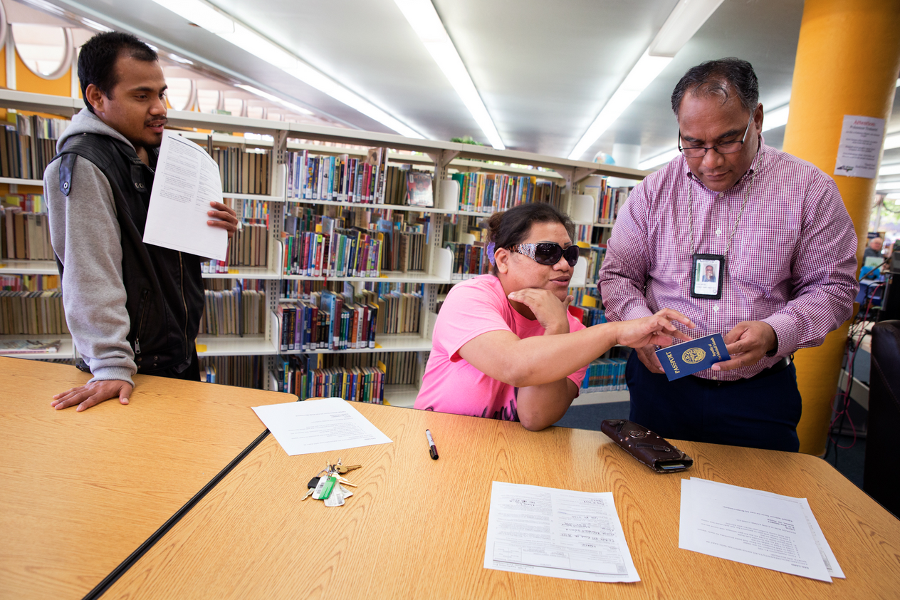 people conversing in a library