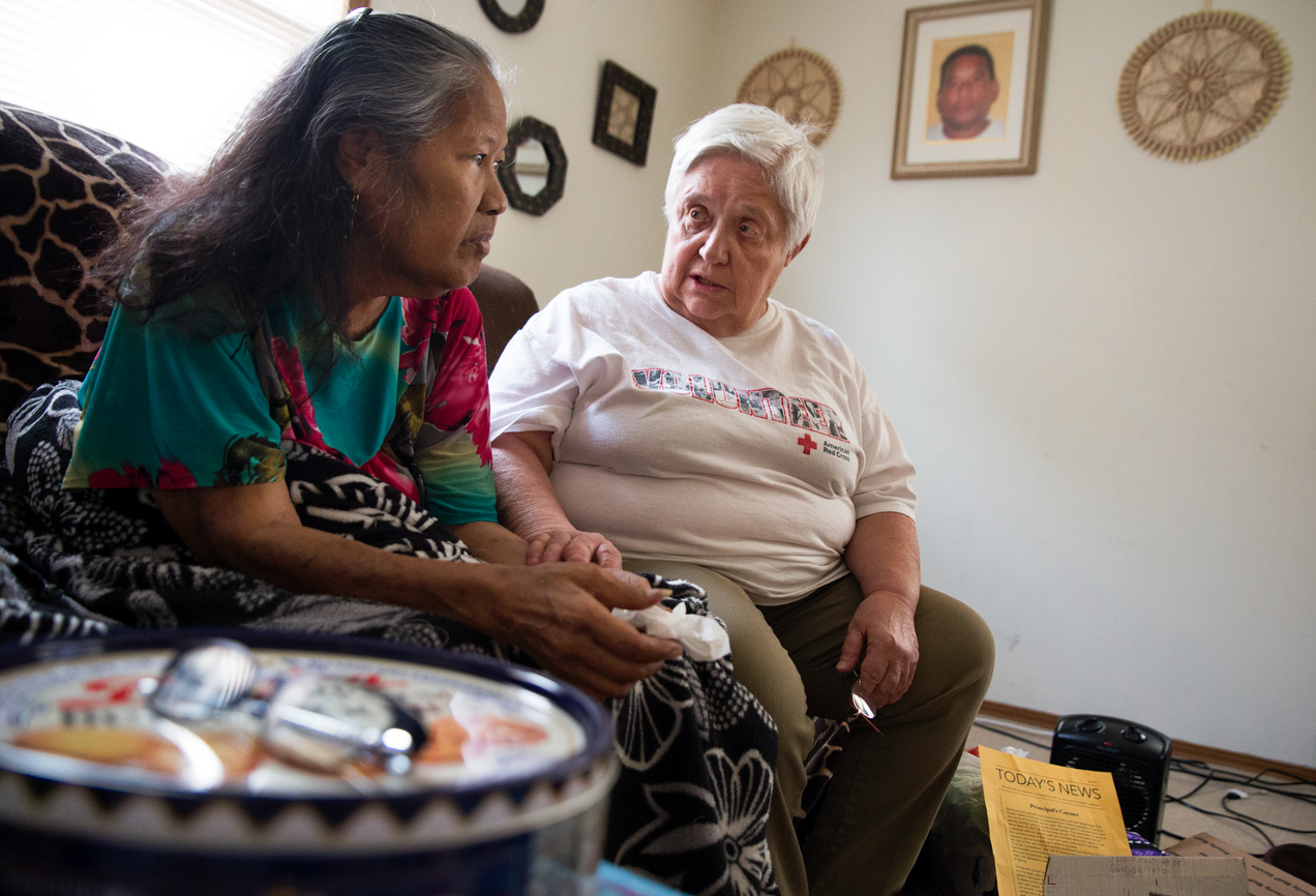 two people sitting in a living room