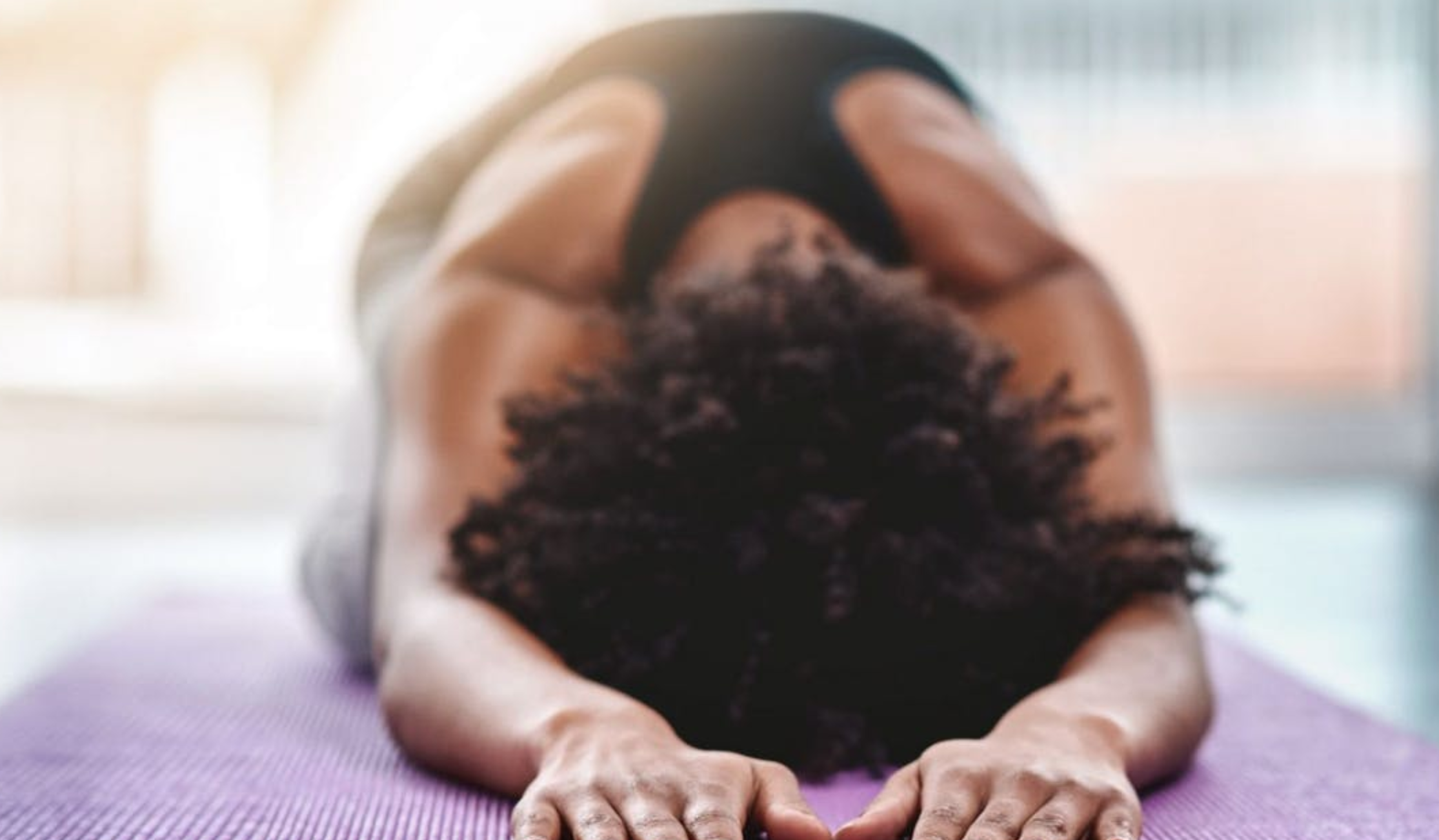 woman reaching forward in a yoga pose