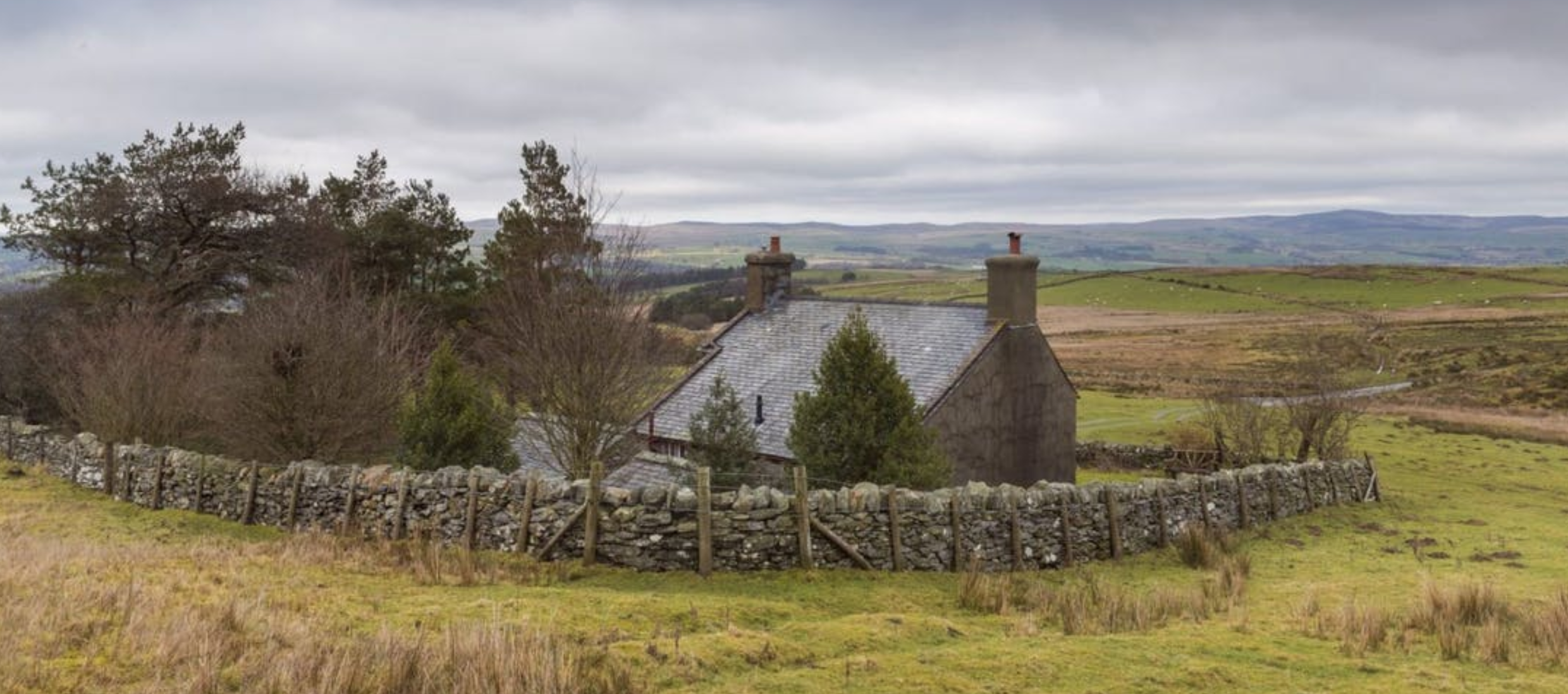 a cottage in a scenic countryside