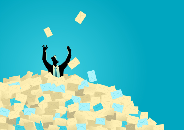 person figuratively drowing in a sea of emails