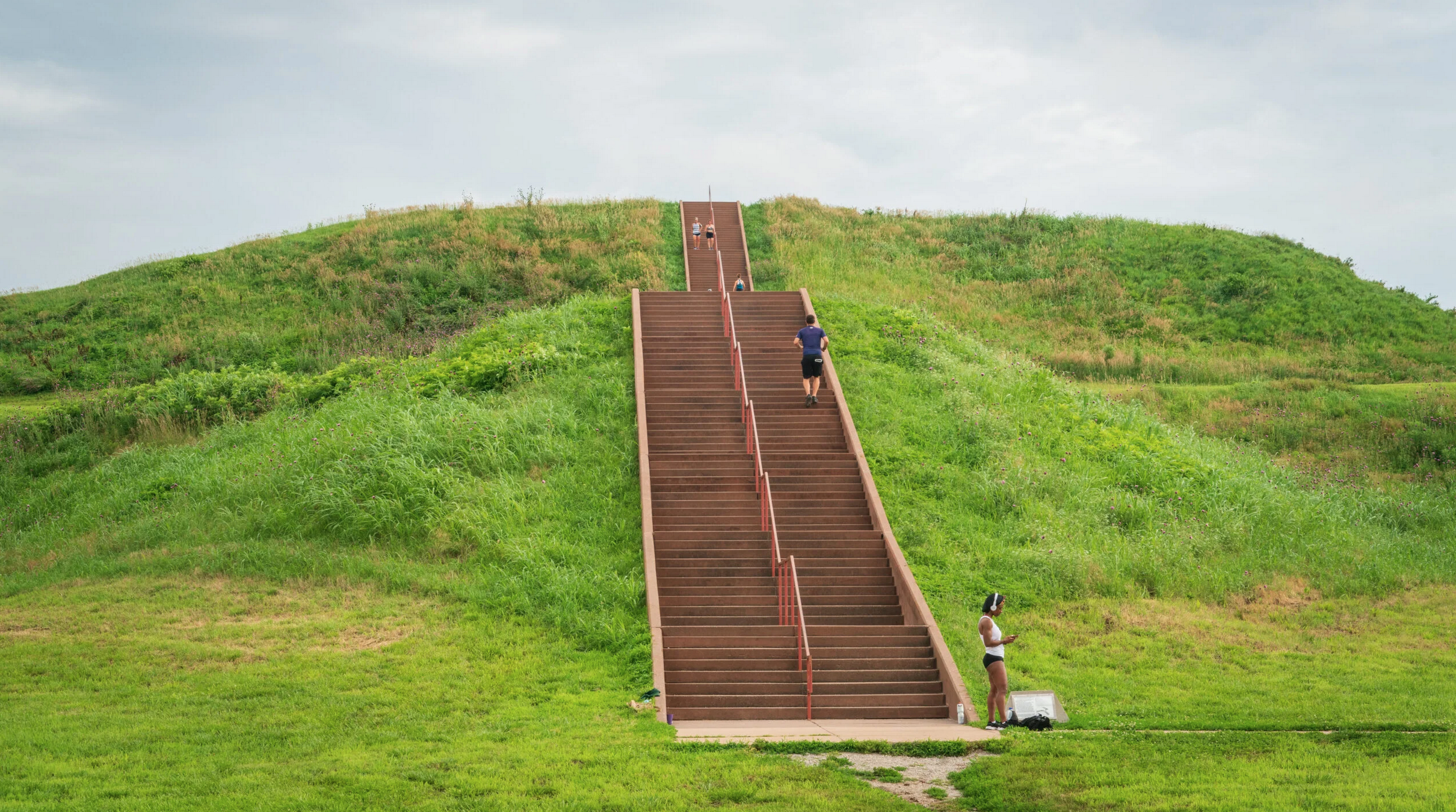 two large hills with a giant staircase thourgh the middle