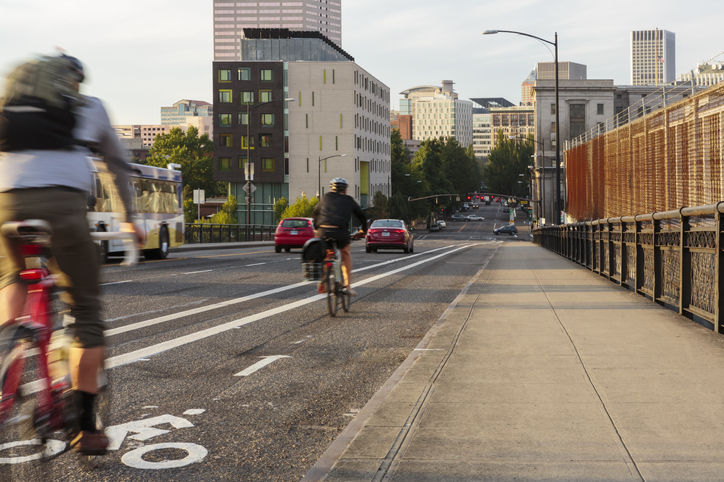 bikers in the bike lane on a city road