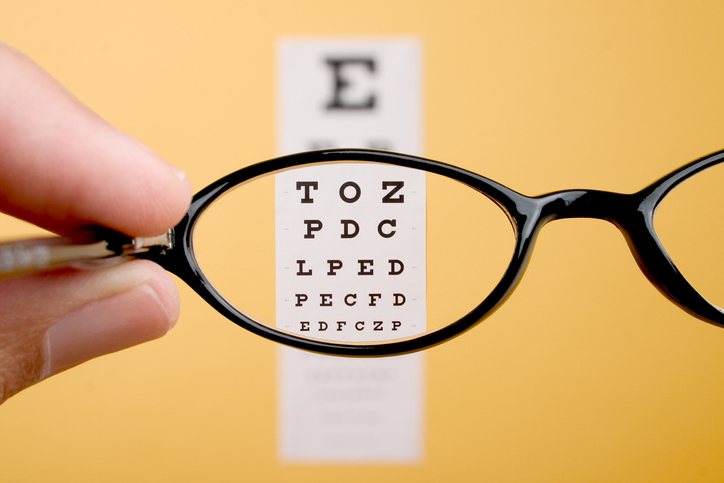 small letters through an eyeglass lens