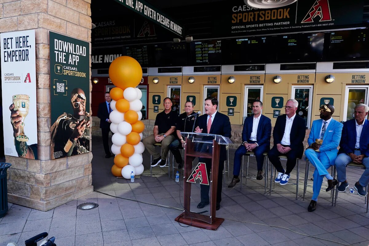 Arizona Gov. Doug Ducey speaks during a 2021 news conference on a partnership between the Arizona Diamondbacks and Caesars Entertainment to set up temporary betting windows at the Diamondbacks’ Chase Field.