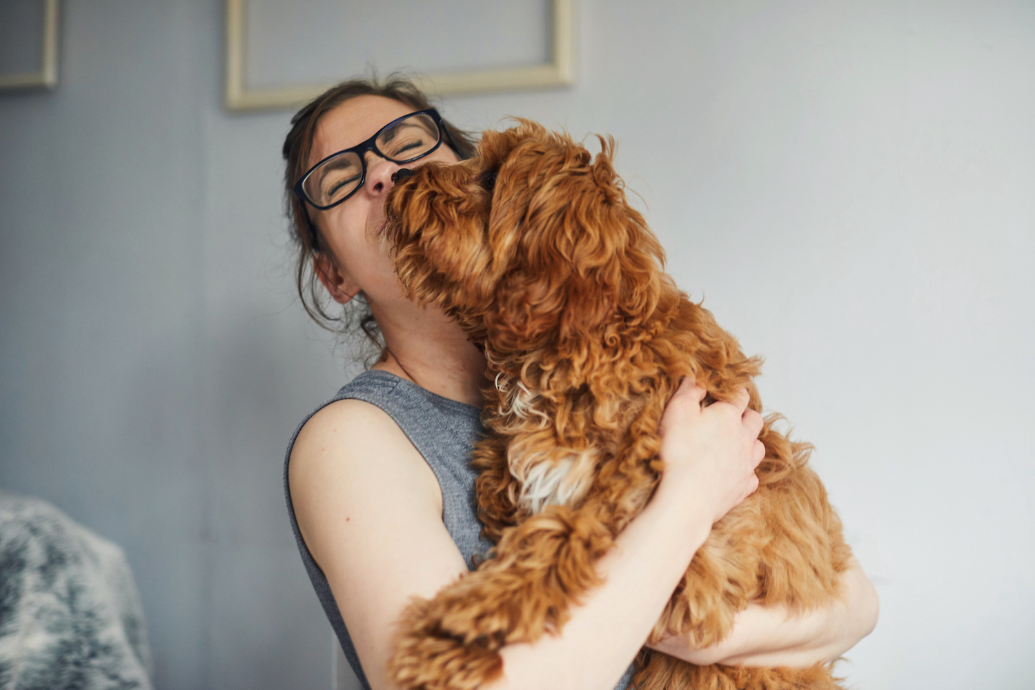 woman hugging dog