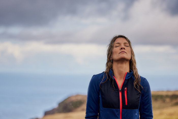 woman with wet hair standing outdoors