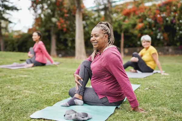 older women doing yoga