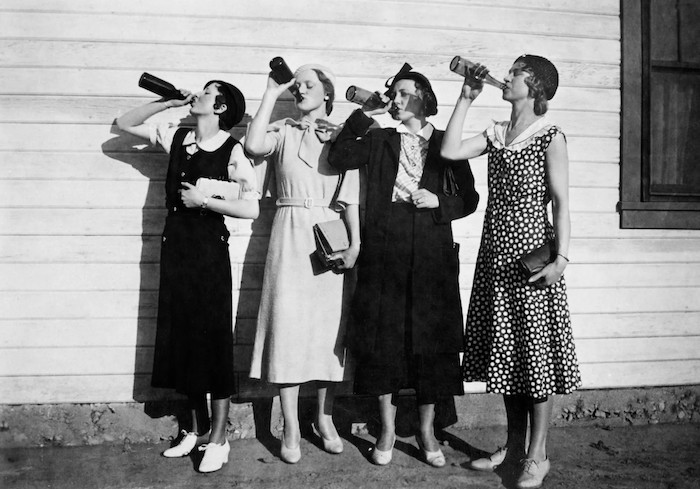 1930s photo of women drinking from bottles