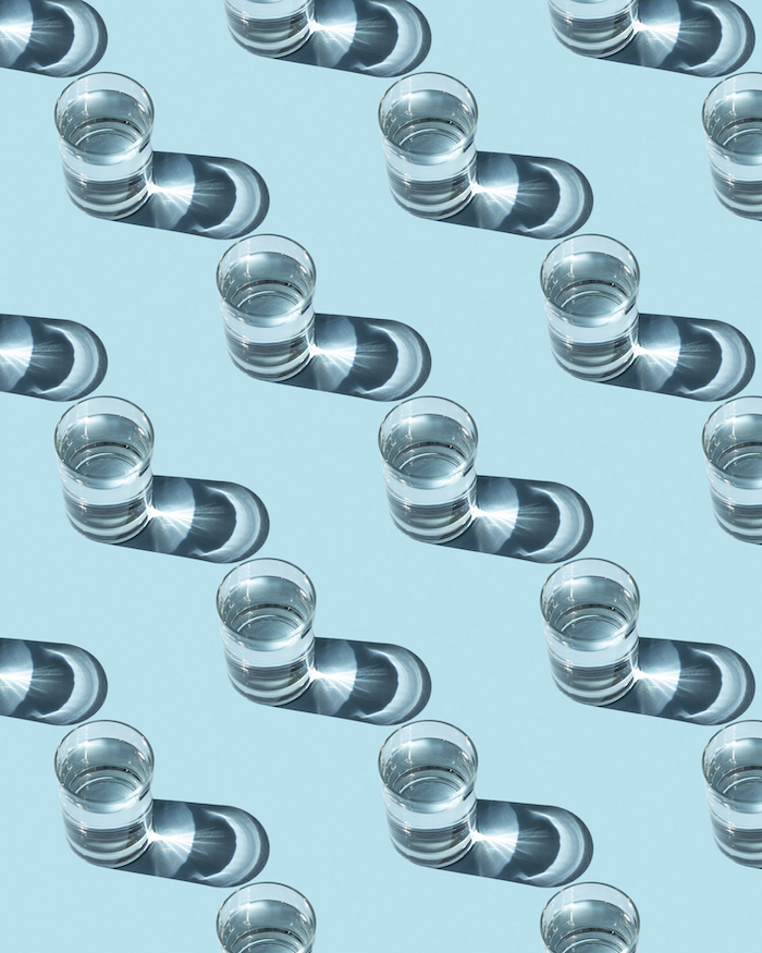 glasses of water on a blue background