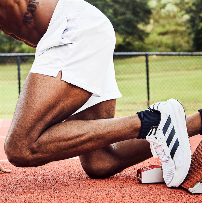 man in starting position on a track